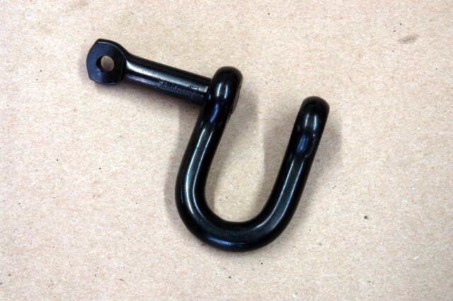 A well made shackle.  We make them black so you can hide them on stage or camera.