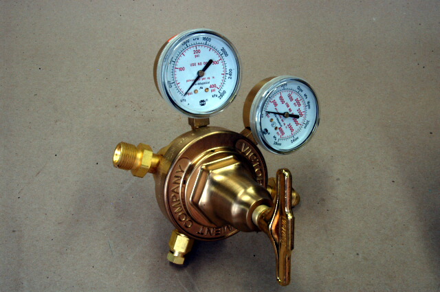 SR 700E regulator.  This regulator has a very high flow rate; the outlet is 3/8 pipe.  We use it to operate various pneumatic effects rigs and lower pressure ratchets.  Not commonly available at your corner welding store.  Has a 580 inlet spud and nut to fit high pressure nitrogen bottles.  A smokin deal at 0.00; list price is 8.00 as of 11/08!